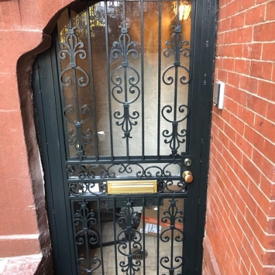 Basement Entrance Gate - Custom iron entrance gate with top & bottom glass and mortise lockset. All painted hunter green.