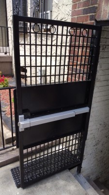Custom gate (divided to small sections) with 20" plate in center, 1 1/2" x 1 1/2" frame, panic exit device and pull handle.