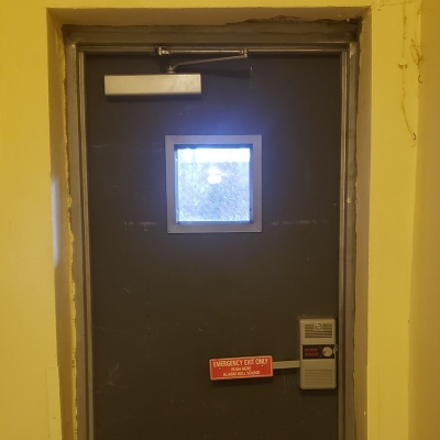 Fire door with vision lite and alarm lock.