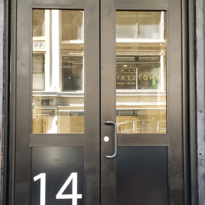 14 W 24th St New York, NY - Pair of wide style aluminum doors.